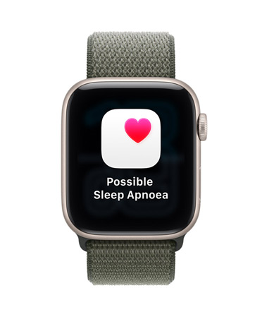 Apple Watch SE 3, aluminium case, starlight colour, possible sleep apnoea notification, pink heart in white box, right side exterior, Digital Crown, Sport Loop, forest colour