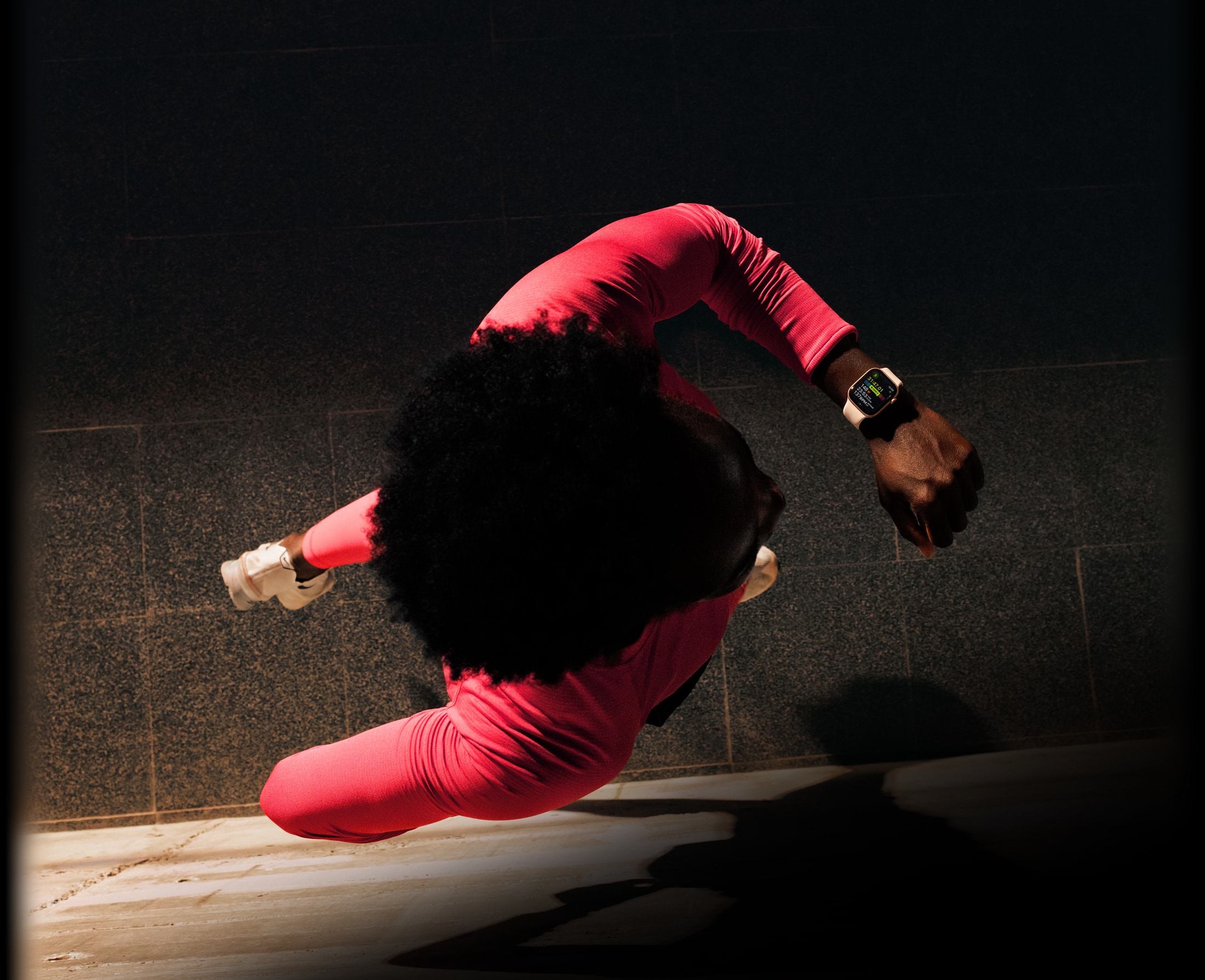 A person checks progress on Apple Watch Series 11 Workout app while running